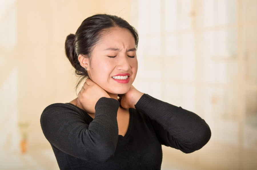 Asian woman with neck pain