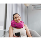 person texting while wearing comfortable neck supporting pillows for sleeping travel spine support - pink